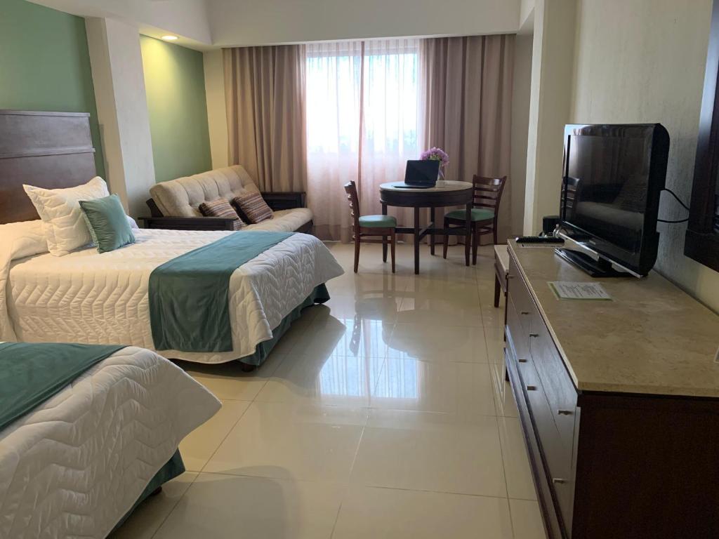 TV a/nebo společenská místnost v ubytování Hotel Bello Veracruz