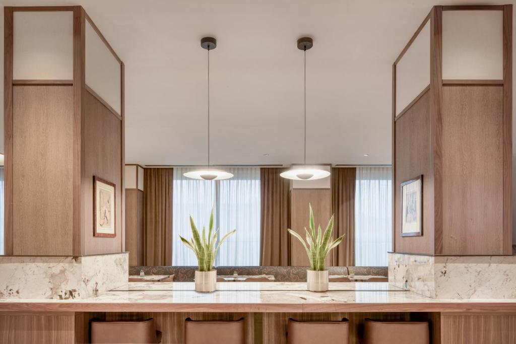 Kuchyň nebo kuchyňský kout v ubytování AC Hotel Milano by Marriott