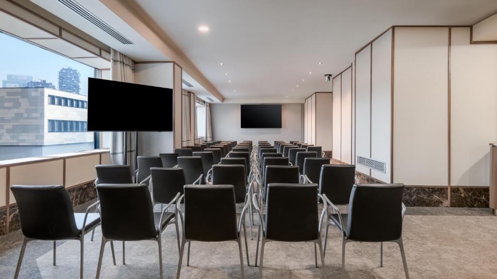 TV a/nebo společenská místnost v ubytování AC Hotel Milano by Marriott