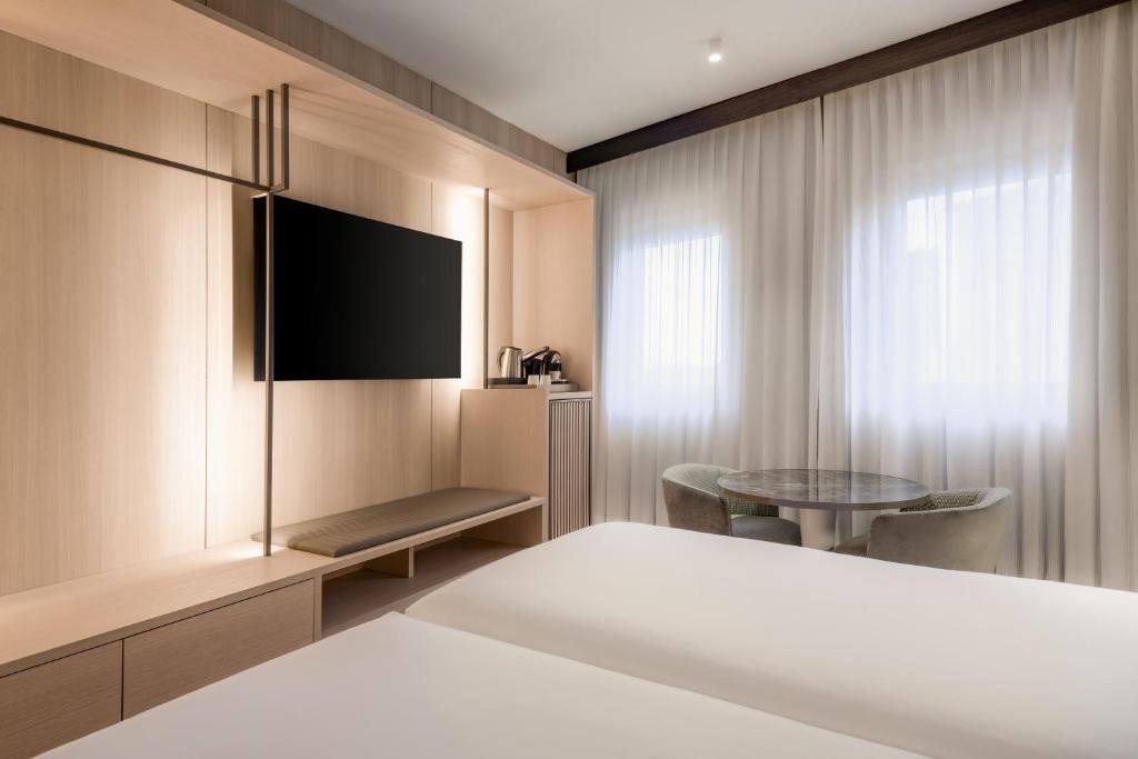 TV a/nebo společenská místnost v ubytování AC Hotel Milano by Marriott