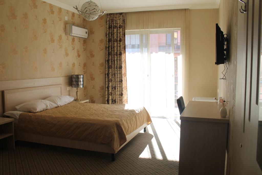 Postel nebo postele na pokoji v ubytování Hotel Elio
