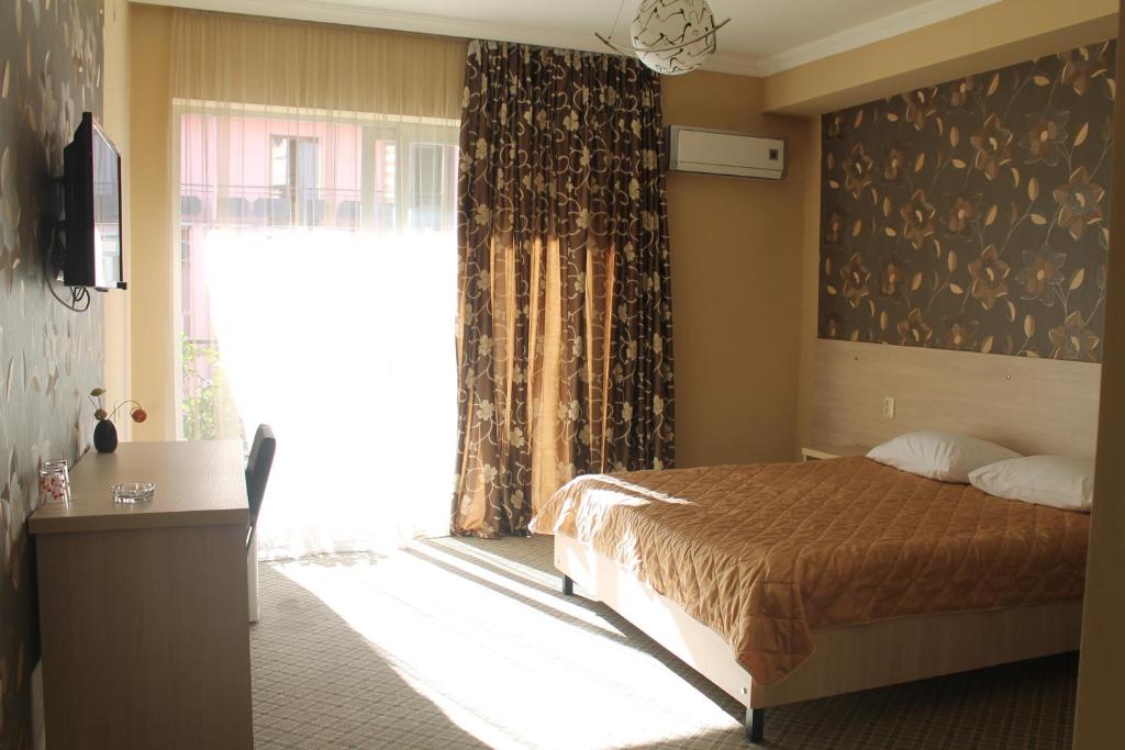 Postel nebo postele na pokoji v ubytování Hotel Elio