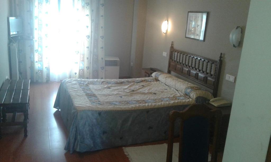 Postel nebo postele na pokoji v ubytování Hotel Casa Aurelia