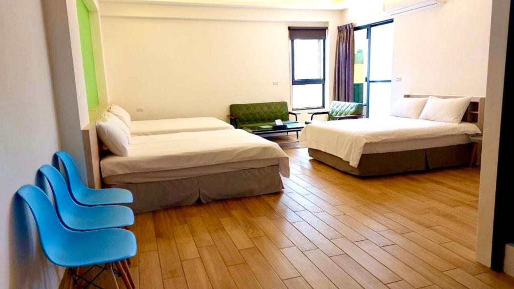 Postel nebo postele na pokoji v ubytování WOW Penghu Homestay