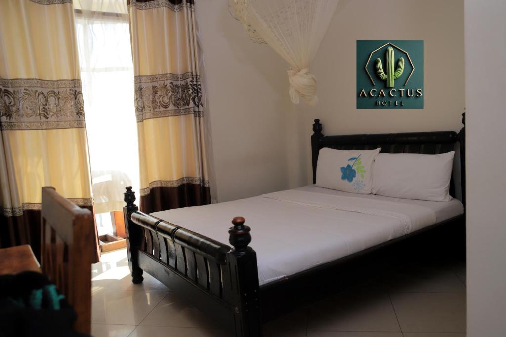 Postel nebo postele na pokoji v ubytování Acactus Hotel