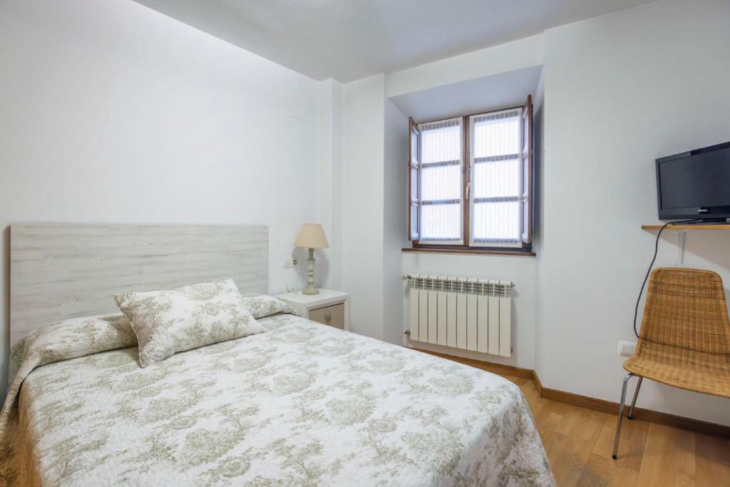 A bed or beds in a room at El Peregrino Llanes VUT