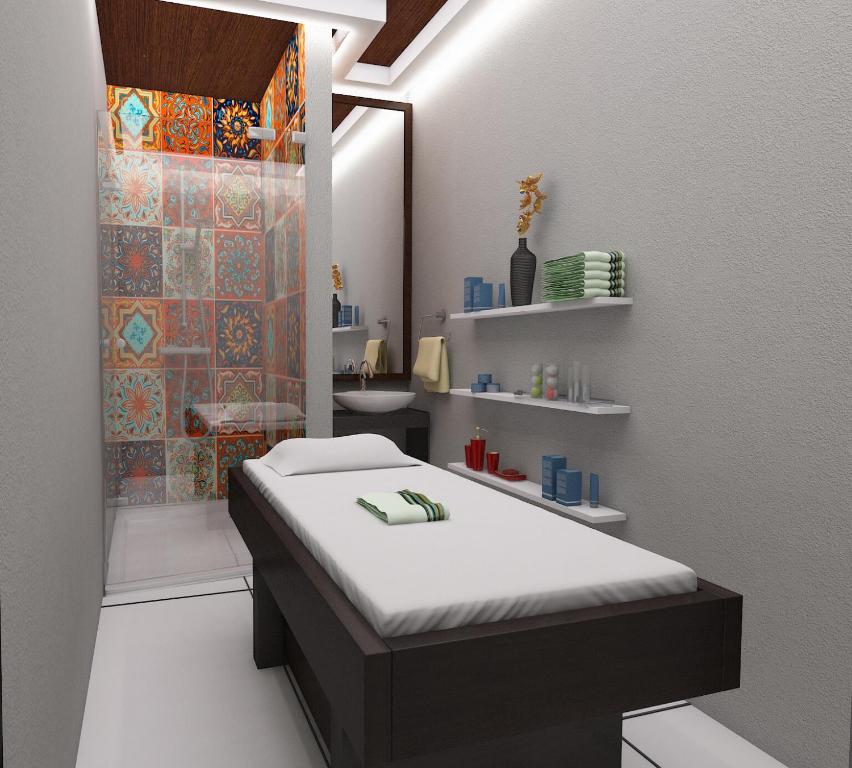 a room with a bed and a shower in a bathroom at King Heritage in Lucknow