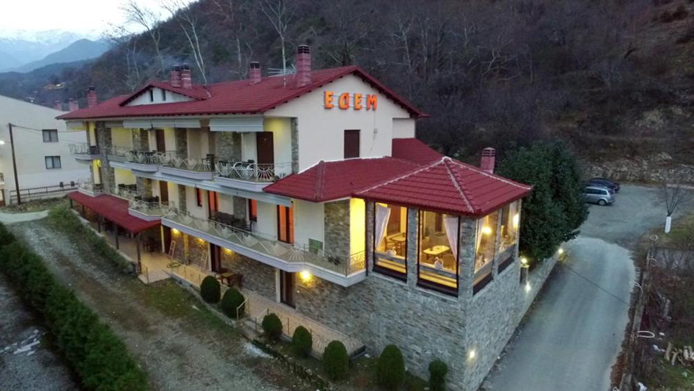 a large house with a red roof at Hotel Edem in Kato Loutraki