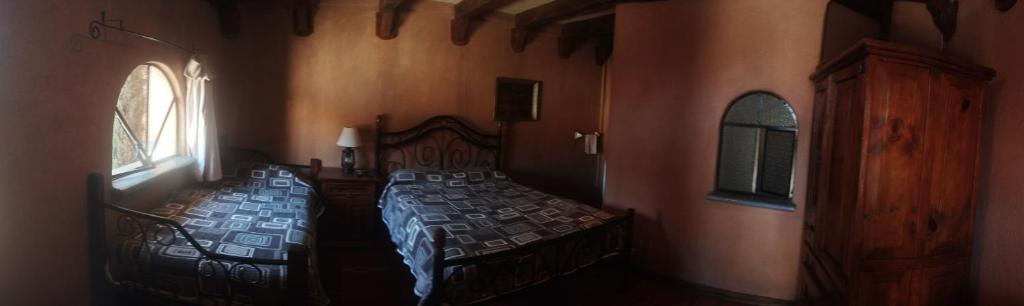 Postel nebo postele na pokoji v ubytování Hosteria Covadonga