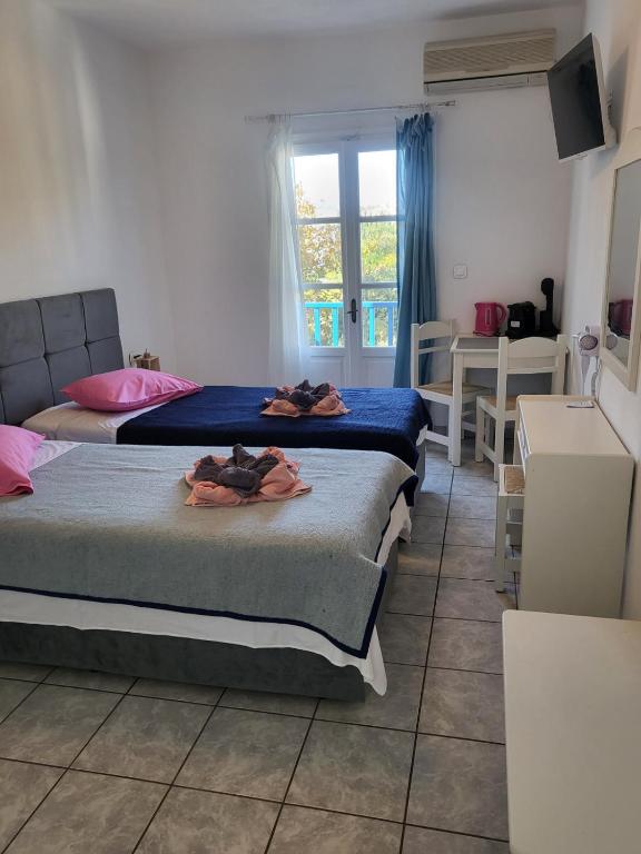 Postel nebo postele na pokoji v ubytování Deep Blue Studios