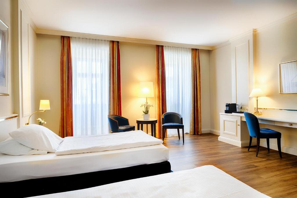 Postel nebo postele na pokoji v ubytování Welcome Hotel Residenzschloss Bamberg
