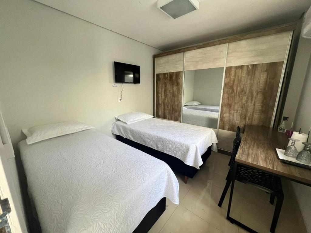 Postel nebo postele na pokoji v ubytování Ziza Hospedagem