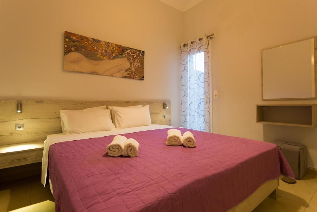Postel nebo postele na pokoji v ubytování Eleni Apartments