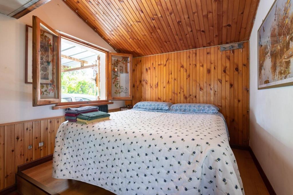 Postel nebo postele na pokoji v ubytování Chalet sul Trasimeno
