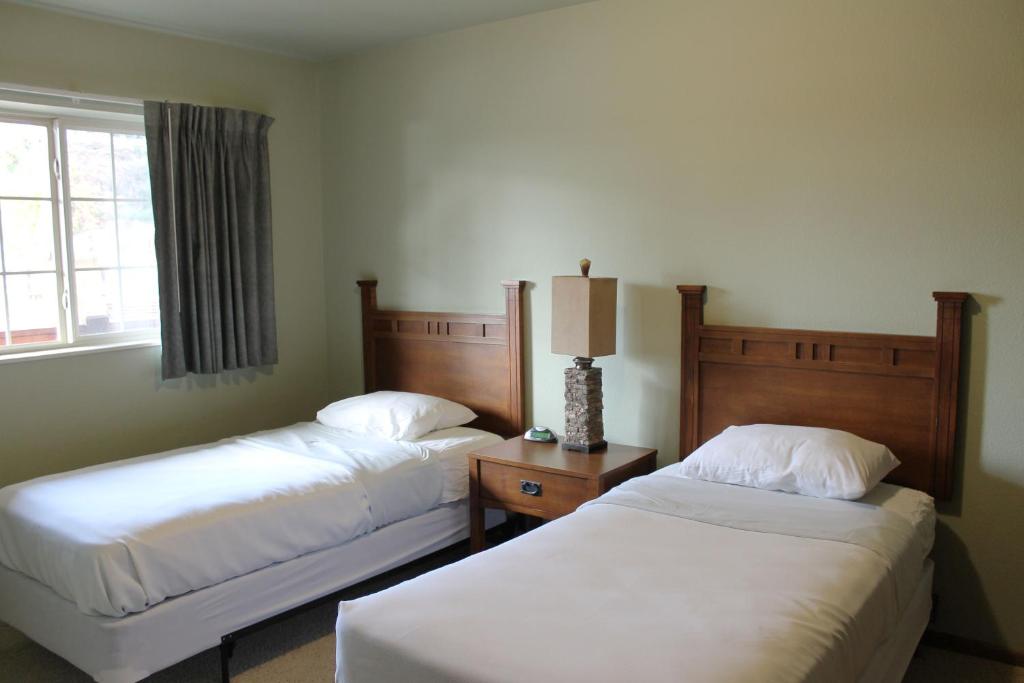 a hotel room with two beds and a window at 2 Bedroom Condo at Wild Eagle Lodge, #232 in Eagle River