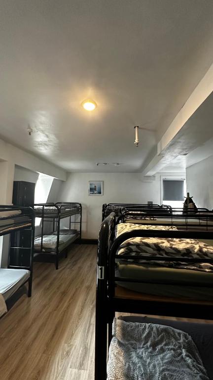 Postel nebo postele na pokoji v ubytování Queen Nest Hotel