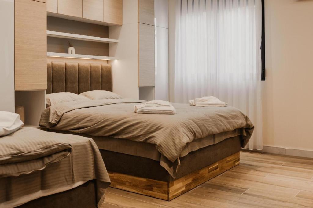 Ένα ή περισσότερα κρεβάτια σε δωμάτιο στο Apartmani "AS"