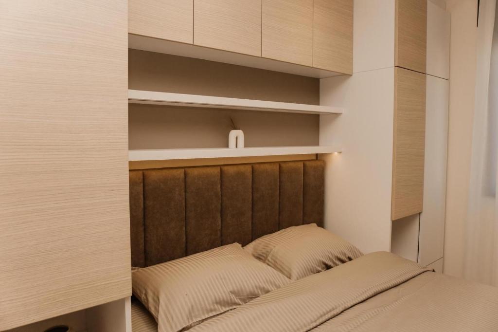 Ένα ή περισσότερα κρεβάτια σε δωμάτιο στο Apartmani "AS"