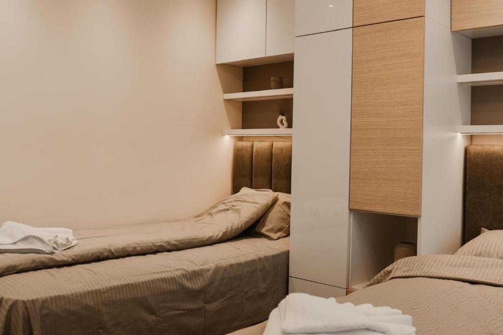 Ένα ή περισσότερα κρεβάτια σε δωμάτιο στο Apartmani "AS"