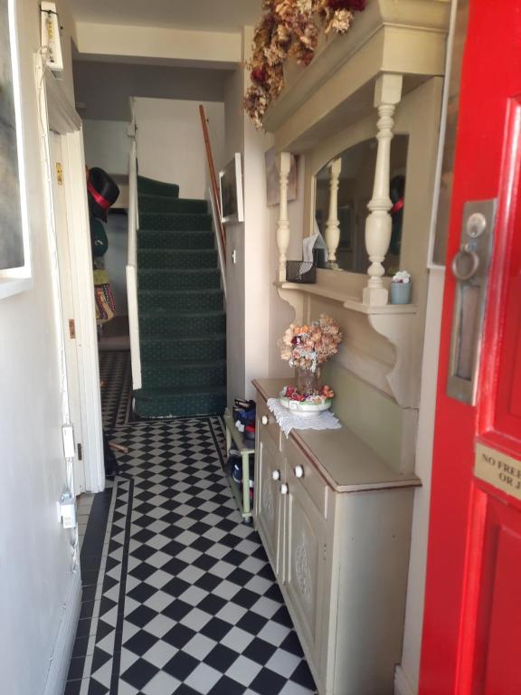 a hallway with a black and white checkered floor at City centre room Ensuite in Cork