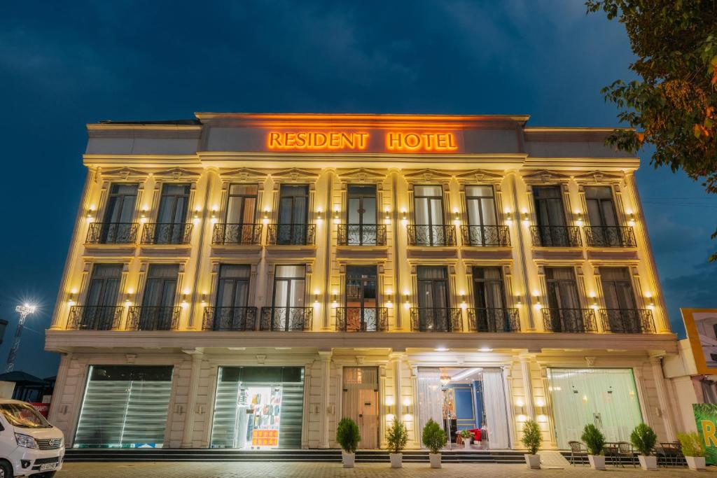 a building with a sign that reads resident hotel at Resident Hotel in Tashkent