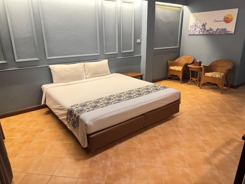 Postel nebo postele na pokoji v ubytování Sun Hotel