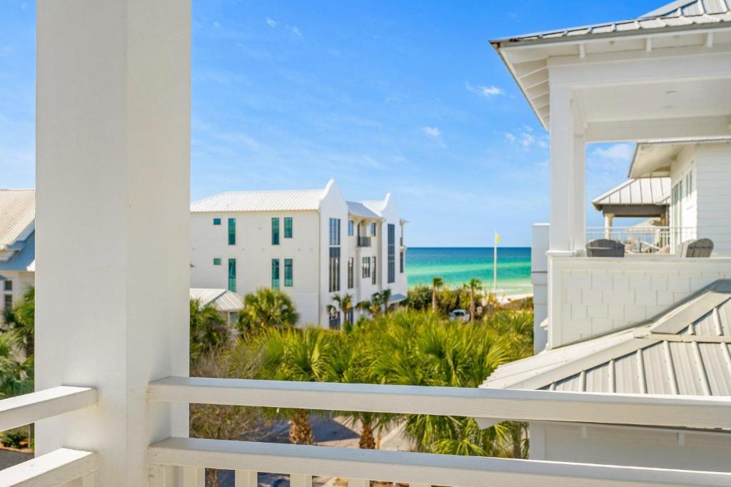 a view of the beach from the balcony of a condo at Sand On Tap in Inlet Beach