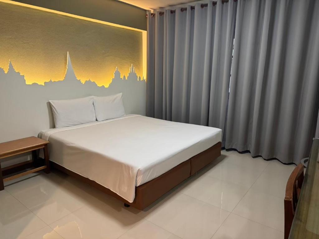Postel nebo postele na pokoji v ubytování Sun Hotel