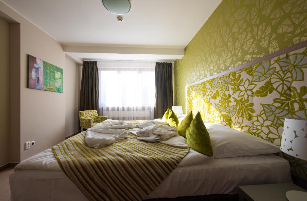 Postel nebo postele na pokoji v ubytování Hotel Bystrá