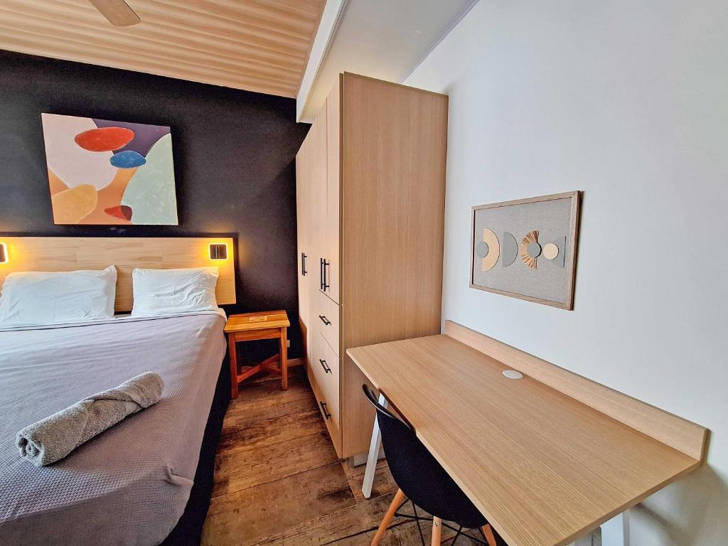 Postel nebo postele na pokoji v ubytování Jungla Urbana, BnB