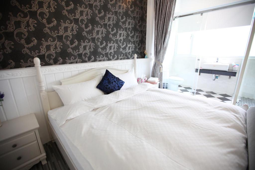 Postel nebo postele na pokoji v ubytování Qing Noise Villas
