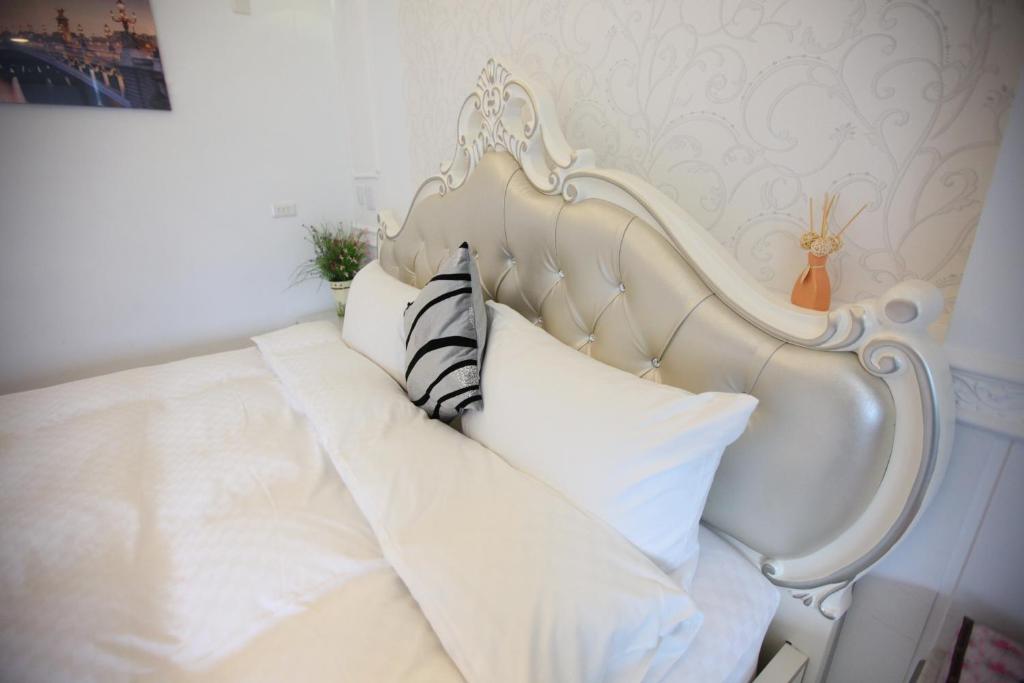 Postel nebo postele na pokoji v ubytování Qing Noise Villas