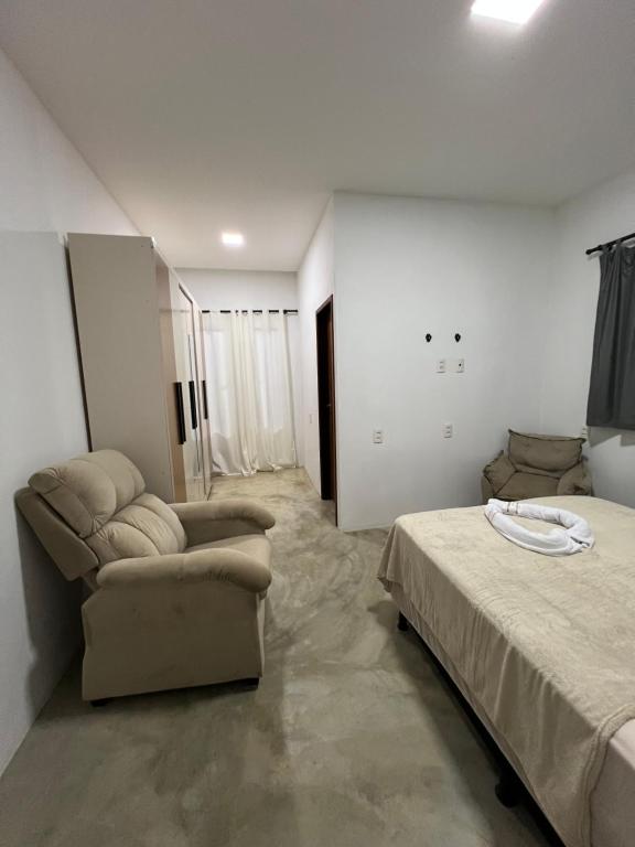 Ένα ή περισσότερα κρεβάτια σε δωμάτιο στο Residence Tropical Premium