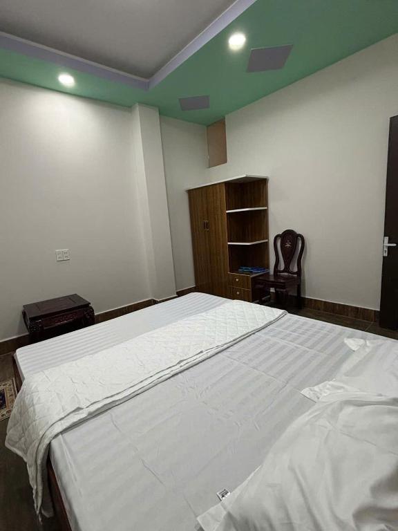 Postel nebo postele na pokoji v ubytování HOTEL MOTeL Đồng Khởi