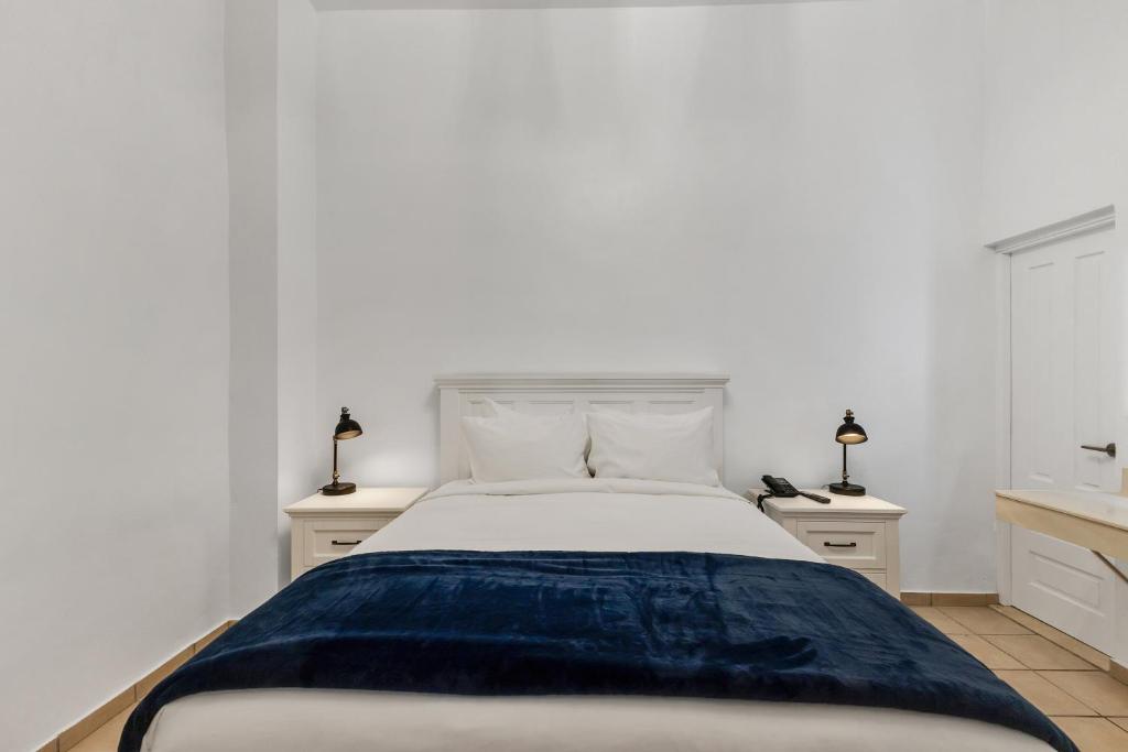 Postel nebo postele na pokoji v ubytování Armas Hotel