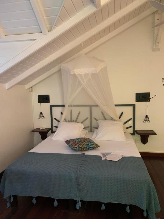 Postel nebo postele na pokoji v ubytování Caraib'Bay Hotel