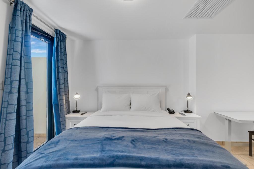 Postel nebo postele na pokoji v ubytování Armas Hotel