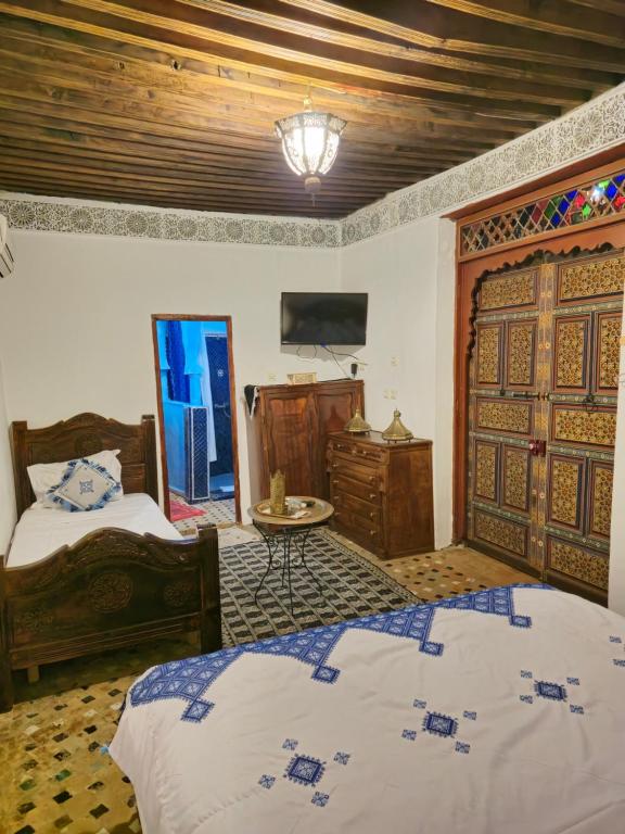 Letto o letti in una camera di Ryad Zahrat Fes