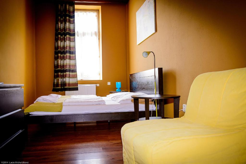 Postel nebo postele na pokoji v ubytování Penzion Pod Kašnou