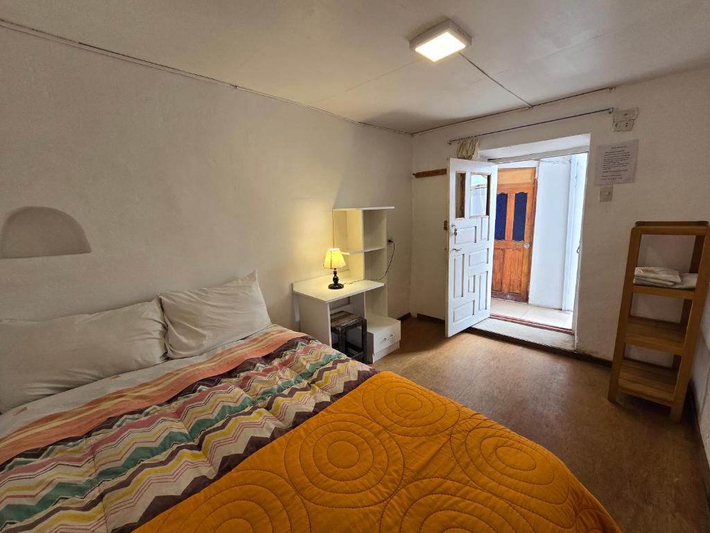 Postel nebo postele na pokoji v ubytování Barrio Inka B&B