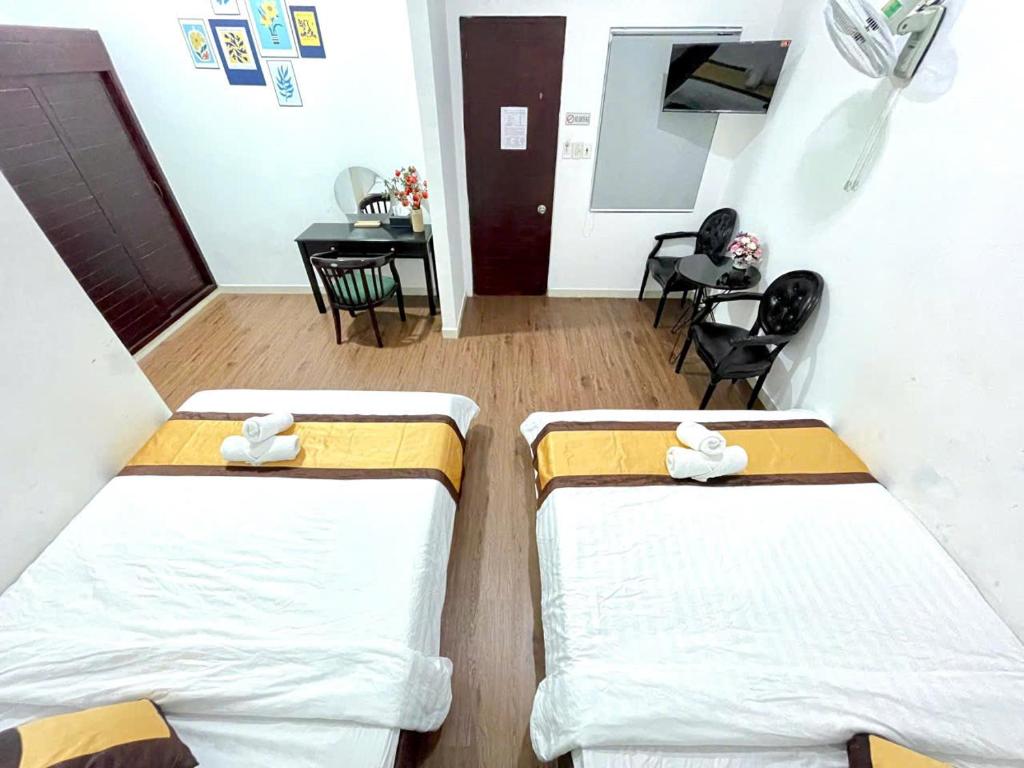 Postel nebo postele na pokoji v ubytování Hotel Đông Nhi