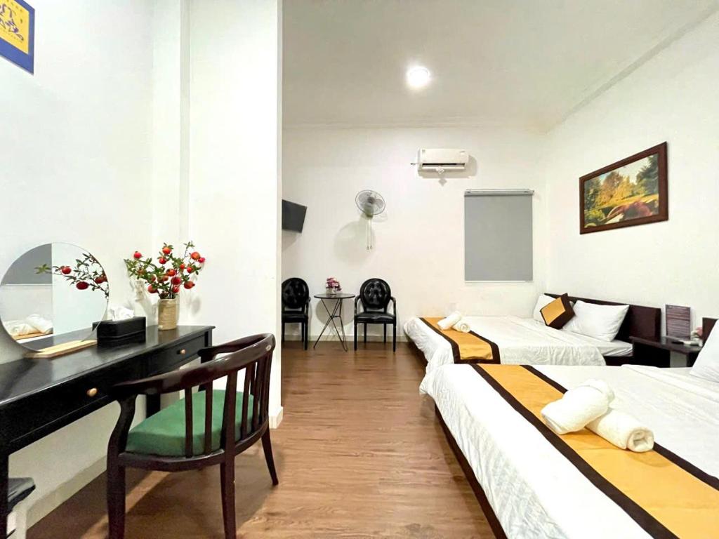 Postel nebo postele na pokoji v ubytování Hotel Đông Nhi