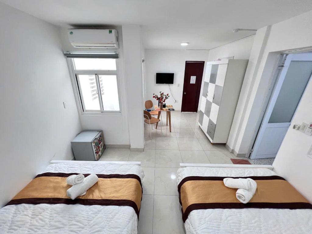 Postel nebo postele na pokoji v ubytování Hotel Đông Nhi