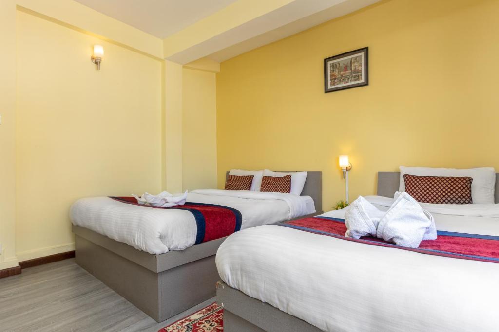 Postel nebo postele na pokoji v ubytování Thamel Hotel & Spa