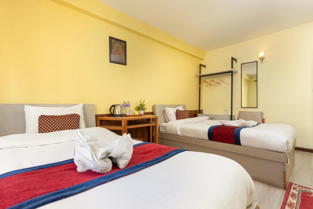 Postel nebo postele na pokoji v ubytování Thamel Hotel & Spa