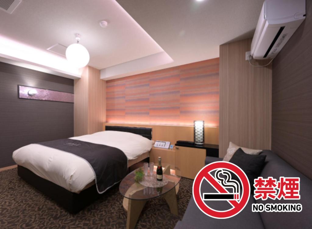 Postel nebo postele na pokoji v ubytování Hotel Aria(Adult Only)
