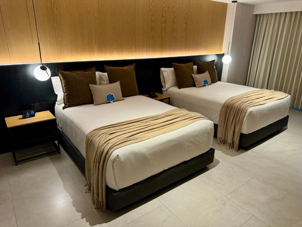 Postel nebo postele na pokoji v ubytování Hotel Aló Degollado