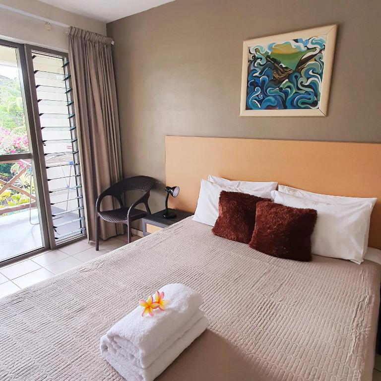 Postel nebo postele na pokoji v ubytování Vaea Hotel Samoa