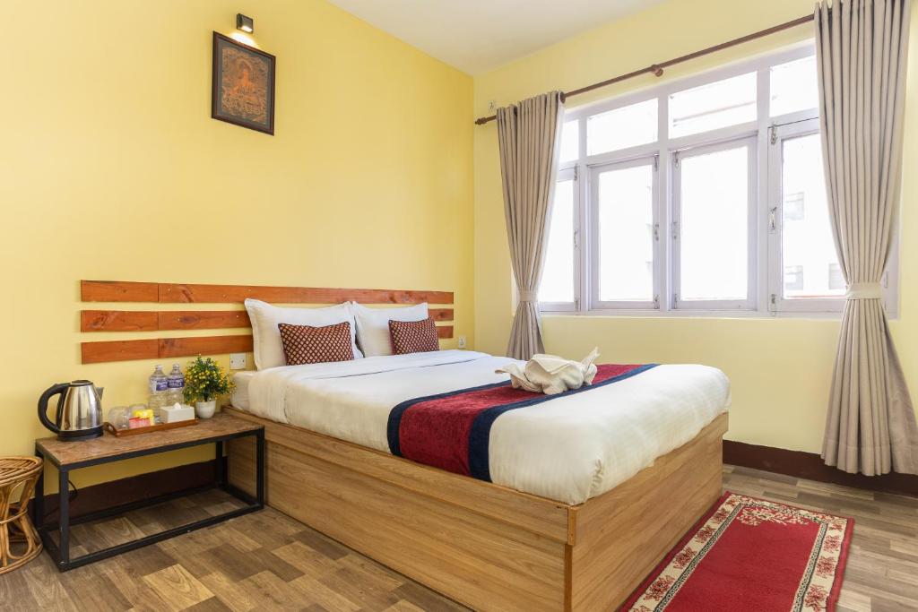 Postel nebo postele na pokoji v ubytování Thamel Hostel & Spa