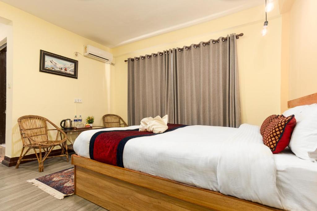 Postel nebo postele na pokoji v ubytování Thamel Hostel & Spa